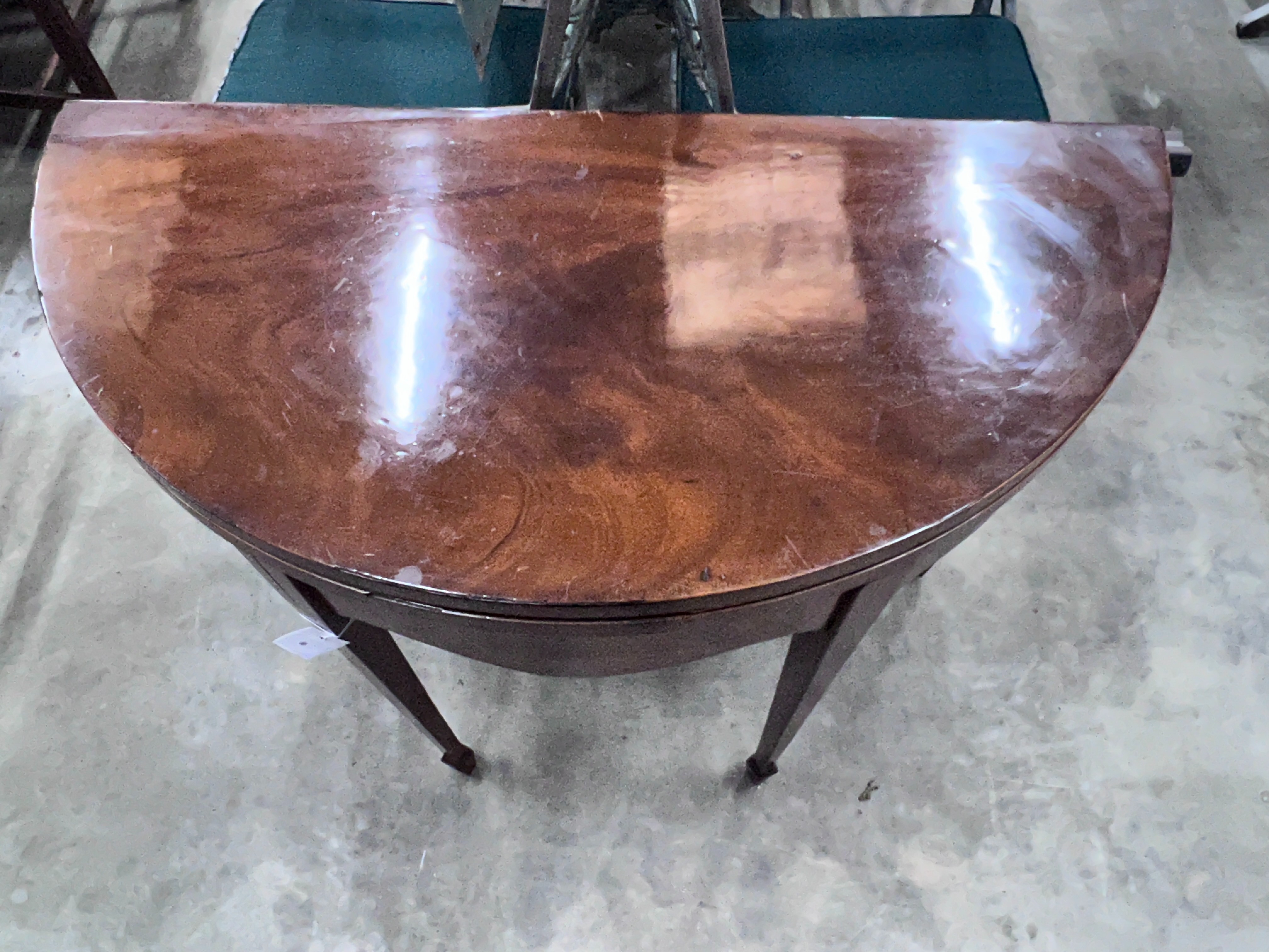 A George III mahogany demi-lune folding tea table, width 92cm, depth 45cm, height 74cm
